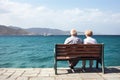 Loving the elderly couple sitting on a bench