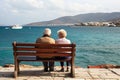 Loving the elderly couple sitting on a bench