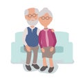 Loving Elderly Man and Woman Couple Sitting hugging on counch
