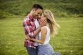Loving embracing coulpe having fun in the spring nature Royalty Free Stock Photo
