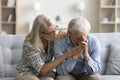 Loving empathetic mature wife consoling depressed elder husband