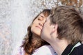 Loving(enamoured) couple kisses against a fountain Royalty Free Stock Photo