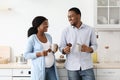 Loving expecting black family drinking tea in kitchen Royalty Free Stock Photo