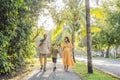 A loving family enjoying a leisurely walk in the park - a radiant pregnant woman after 40, embraced by her husband Royalty Free Stock Photo