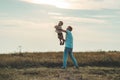 Loving family. Father and his son baby boy playing and hugging outdoors. Happy dad and son outdoors. Concept of Father`s day. Royalty Free Stock Photo