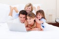 Loving family looking at a laptop Royalty Free Stock Photo