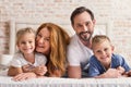 Loving family lying on bed Royalty Free Stock Photo