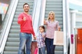 Loving family using escalator Royalty Free Stock Photo