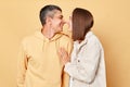 Loving family wife and husband looking at each other with love and gently smiles, woman and man wearing casual style clothing