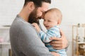 Loving father embracing his cute baby son Royalty Free Stock Photo