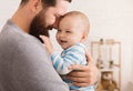 Loving father embracing his cute baby son Royalty Free Stock Photo