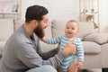 Loving father embracing his cute baby son Royalty Free Stock Photo