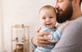 Loving father embracing his cute baby son Royalty Free Stock Photo