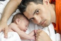 Loving father holding his new born baby. Royalty Free Stock Photo