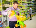 Father choosing playthings in toy store