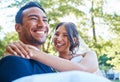 Loving groom carrying his bride in his arms in nature. Happy romantic couple enjoying their wedding day. Beautiful bride Royalty Free Stock Photo