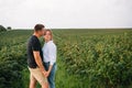 Loving guy and girl walking in nature.concept of love story outdoor.Lovers Walking in spring park.stylish couple in love hugging Royalty Free Stock Photo