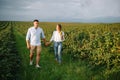 Loving guy and girl walking in nature.concept of love story outdoor.Lovers Walking in spring park.stylish couple in love