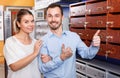 Loving happy couple choosing mailbox in hardware store Royalty Free Stock Photo