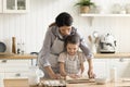 Loving Hispanic mom teach her preschooler daughter to cook Royalty Free Stock Photo