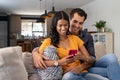 Loving indian couple using smartphone togetrher Royalty Free Stock Photo