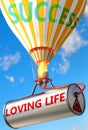 Loving life and success - pictured as word Loving life and a balloon, to symbolize that Loving life can help achieving success and