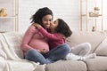 Loving Little Girl Kissing And Embracing Her Pregnant Afro Mom Royalty Free Stock Photo