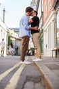 Loving Male Gay Couple Kissing Outside In City Street