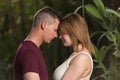 Loving man and happy pregnant woman in a summer park. Royalty Free Stock Photo