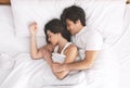 Loving married couple sleeping in bed and hugging Royalty Free Stock Photo