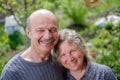 Loving Mature Couple In Back Yard Garden in Sunny Day Royalty Free Stock Photo