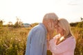 Loving Mature Couple In Countryside Head To Head Against Flaring Sun