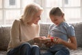 Caring senior grandmother congratulate granddaughter with birthday Royalty Free Stock Photo