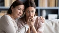 Loving middle aged mother hugging comforting adult daughter Royalty Free Stock Photo