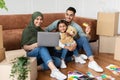 Happy man woman and girl using laptop and credit card Royalty Free Stock Photo