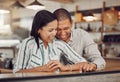 Loving mixed race couple laughing and enjoying time together on first date. Young woman and man on a coffee date in a Royalty Free Stock Photo