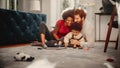 Loving Mixed Race Family Playing with Toys with Adorable Baby Boy at Home on Living Room Floor. Ch Royalty Free Stock Photo