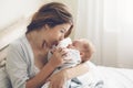 Loving mom carying of her newborn baby at home Royalty Free Stock Photo