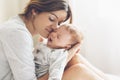 Loving mom carying of her newborn baby at home Royalty Free Stock Photo