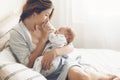 Loving mom carying of her newborn baby at home Royalty Free Stock Photo