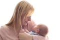 Loving mom holds her newborn baby in her arms, cute tiny baby. Portrait a Mom and her baby. The concept of a happy family Royalty Free Stock Photo