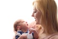 Loving mom holds her newborn baby in her arms, cute tiny baby. Portrait a Mom and her baby. The concept of a happy family Royalty Free Stock Photo