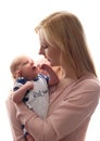 Loving mom holds her newborn baby in her arms, cute tiny baby. Portrait a Mom and her baby. The concept of a happy family Royalty Free Stock Photo