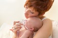 Loving mom treating sick baby Royalty Free Stock Photo