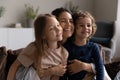 Loving mother cuddling her son and daughter, close up photo Royalty Free Stock Photo