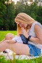 Loving mother with her newborn baby on her arms. Royalty Free Stock Photo