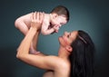 Loving mother holding baby - studio shot Royalty Free Stock Photo