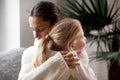 Loving mother hugging little girl, moms love and adoption concep Royalty Free Stock Photo