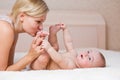 Loving mother kissing happy baby boy Royalty Free Stock Photo