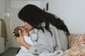 Loving mother kissing her infant baby Royalty Free Stock Photo